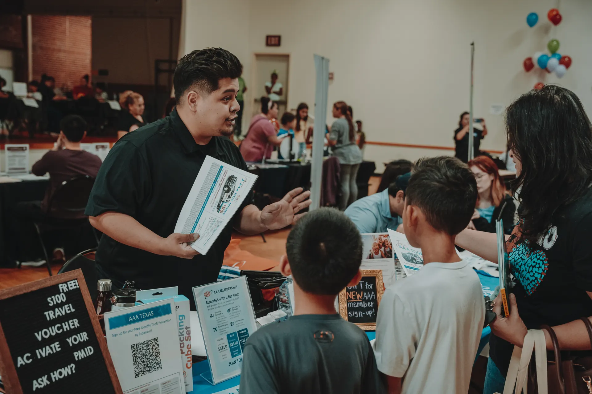 A community resource table at Community Day
