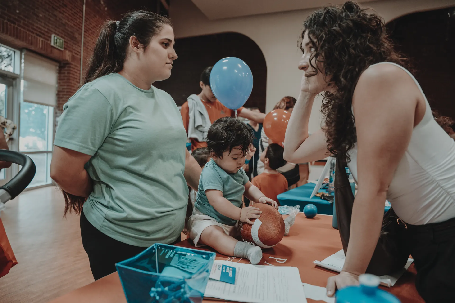 A family services table at Community Day
